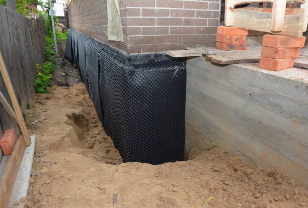 SJ Waterproofing Pros technician performing targeted Exterior Waterproofing assessment in Coshocton, OH